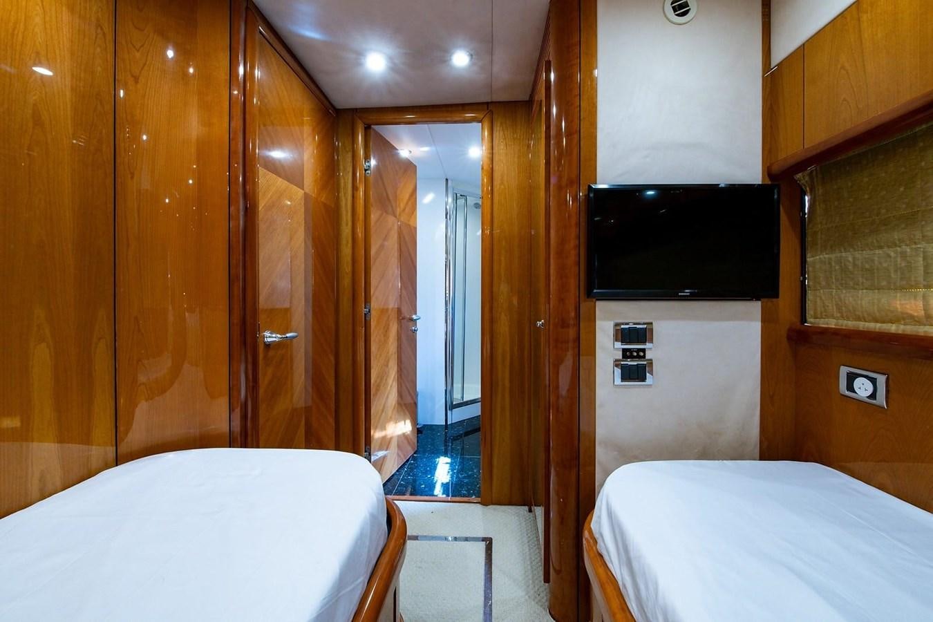 a room with a bed and a television aboard 82 SUNSEEKER MANHATTAN  Yacht for Sale