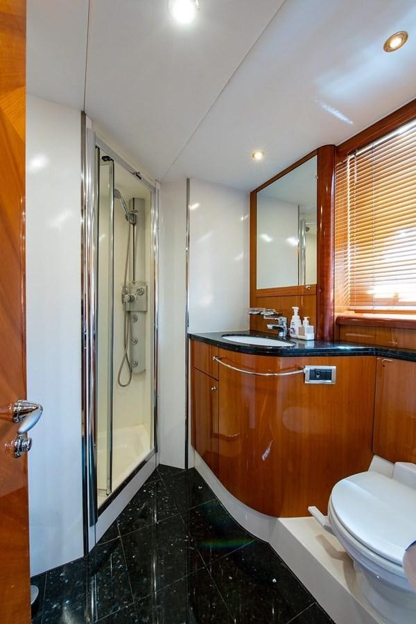 a bathroom with a glass shower aboard 82 SUNSEEKER MANHATTAN  Yacht for Sale