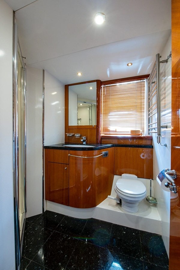 a bathroom with a toilet and a sink aboard 82 SUNSEEKER MANHATTAN  Yacht for Sale