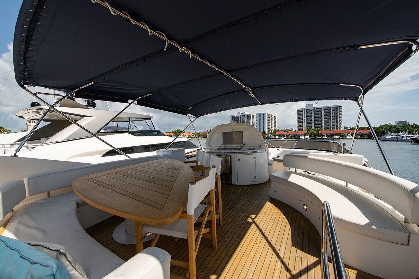 a boat with a large black umbrella aboard 82 SUNSEEKER MANHATTAN  Yacht for Sale