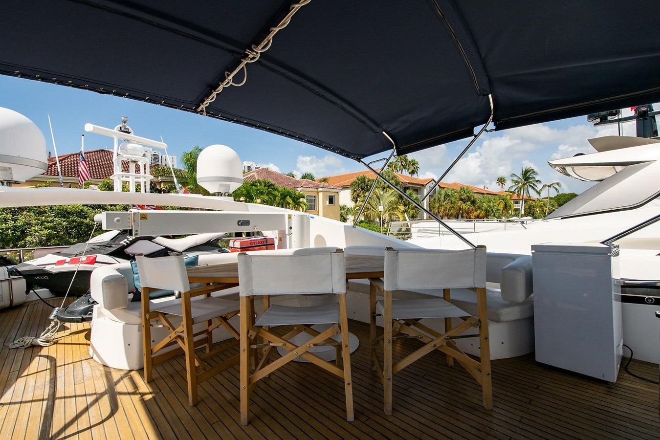 a table and chairs on a deck aboard 82 SUNSEEKER MANHATTAN  Yacht for Sale