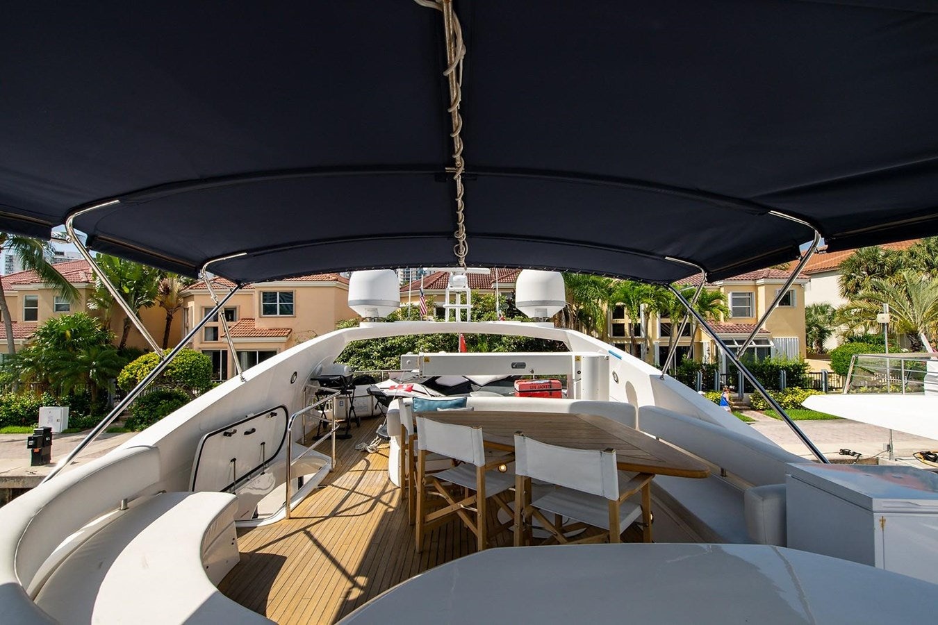 a deck with a table and chairs on it aboard 82 SUNSEEKER MANHATTAN  Yacht for Sale