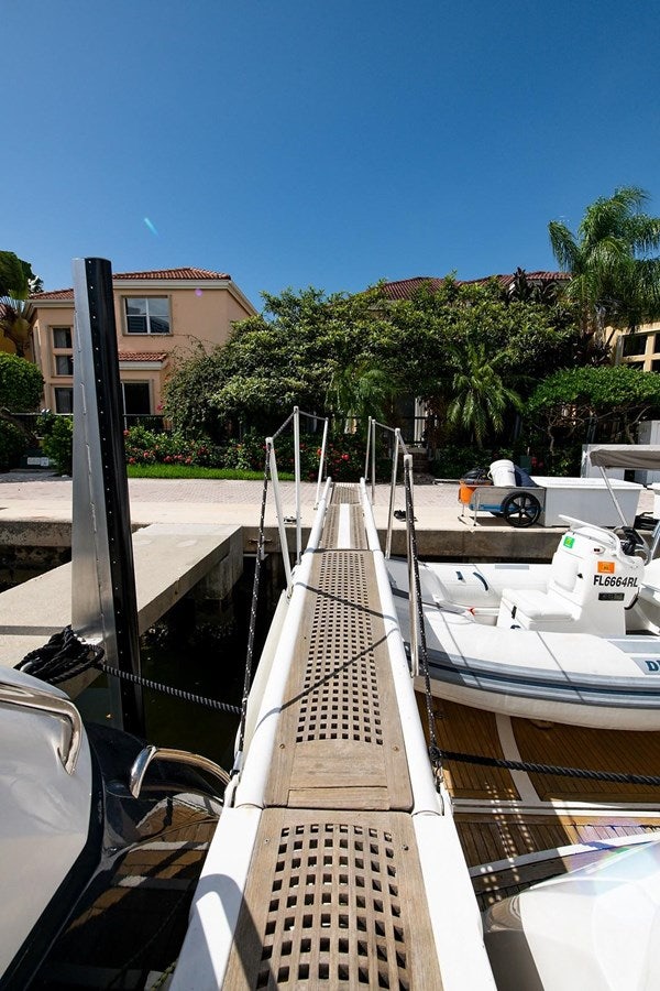 a boat docked at a pier aboard 82 SUNSEEKER MANHATTAN  Yacht for Sale