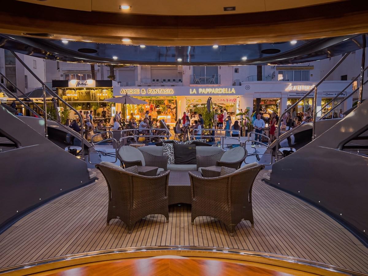a restaurant with a large table and chairs aboard MATSU Yacht for Sale