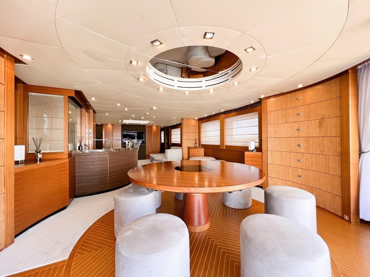 a room with a table and chairs aboard MATSU Yacht for Sale