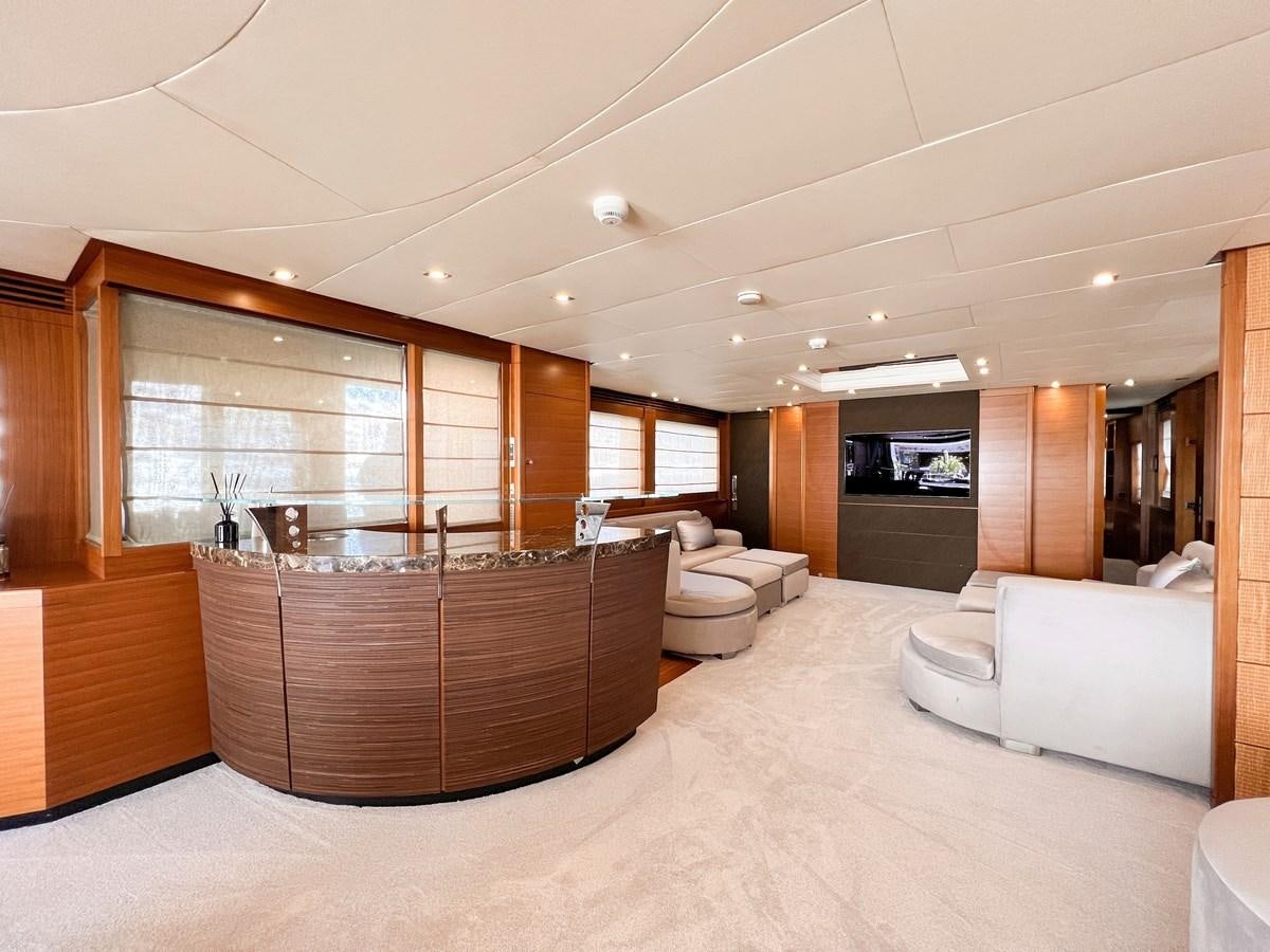 a large room with a large glass window and a large wood cabinet aboard MATSU Yacht for Sale