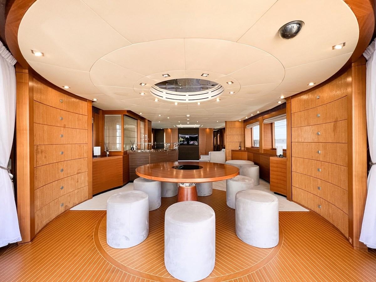 a room with a table and chairs aboard MATSU Yacht for Sale