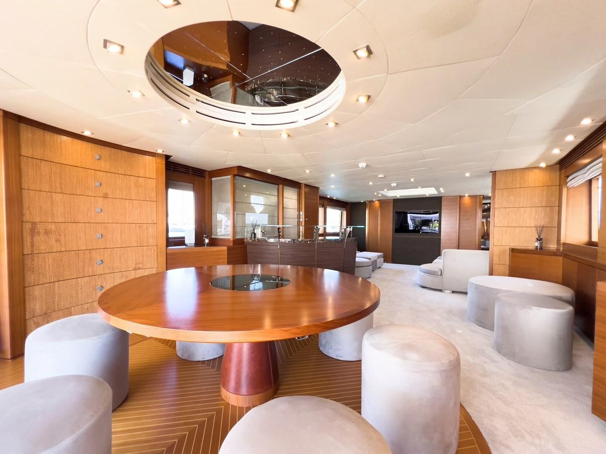 a room with a table and chairs aboard MATSU Yacht for Sale