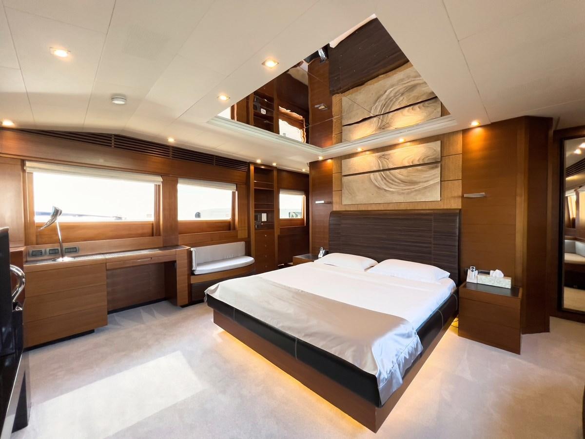 a room with a bed and a wood wall aboard MATSU Yacht for Sale