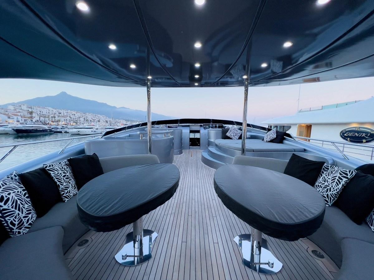 a room with a table and chairs aboard MATSU Yacht for Sale