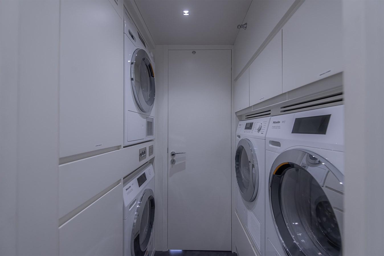 a room with white cabinets aboard ASLAN Yacht for Sale