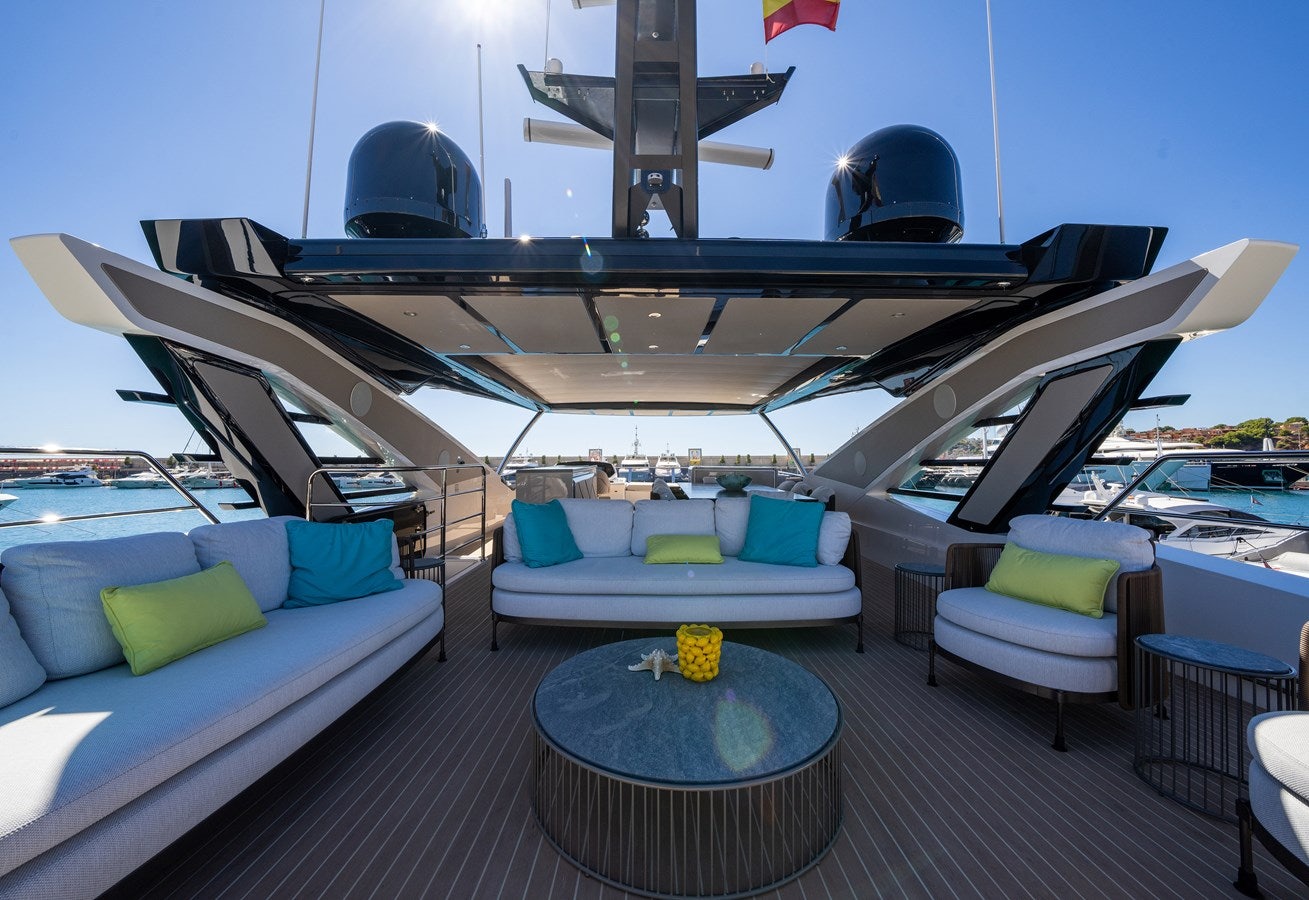 a boat with a table and chairs aboard BANDAZUL Yacht for Sale