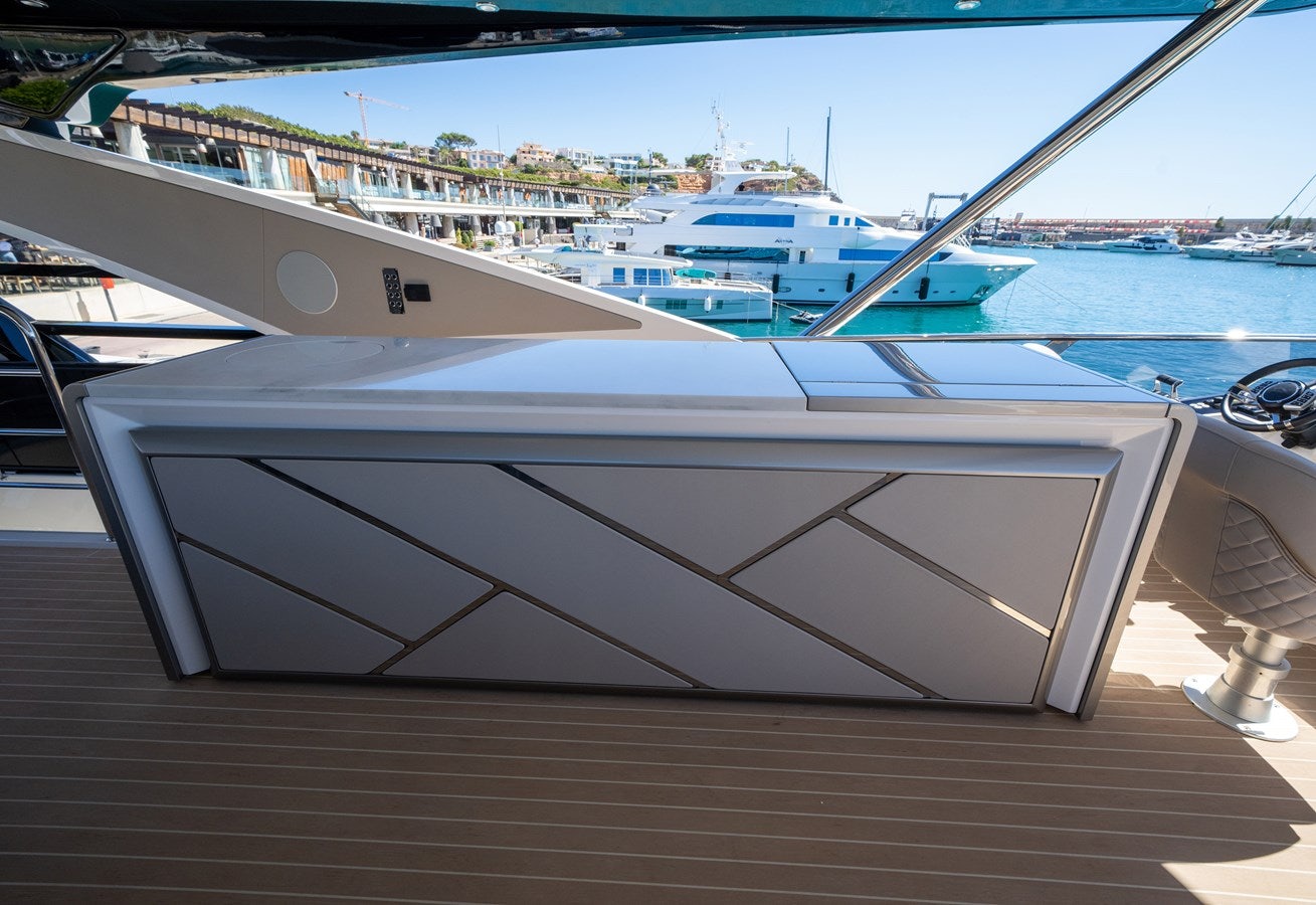 a white boat on a dock aboard BANDAZUL Yacht for Sale