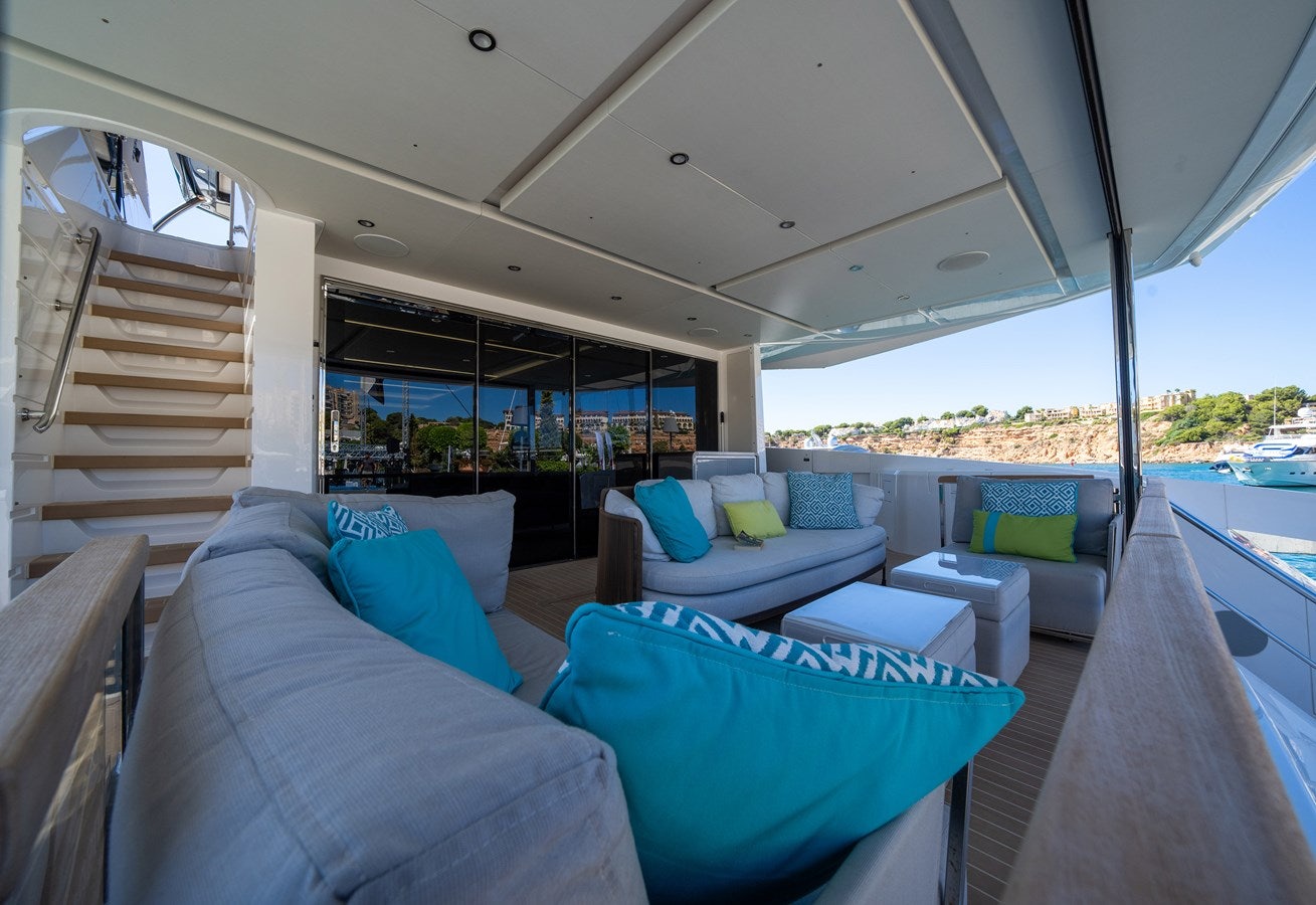 a large living room with a view of the water aboard BANDAZUL Yacht for Sale