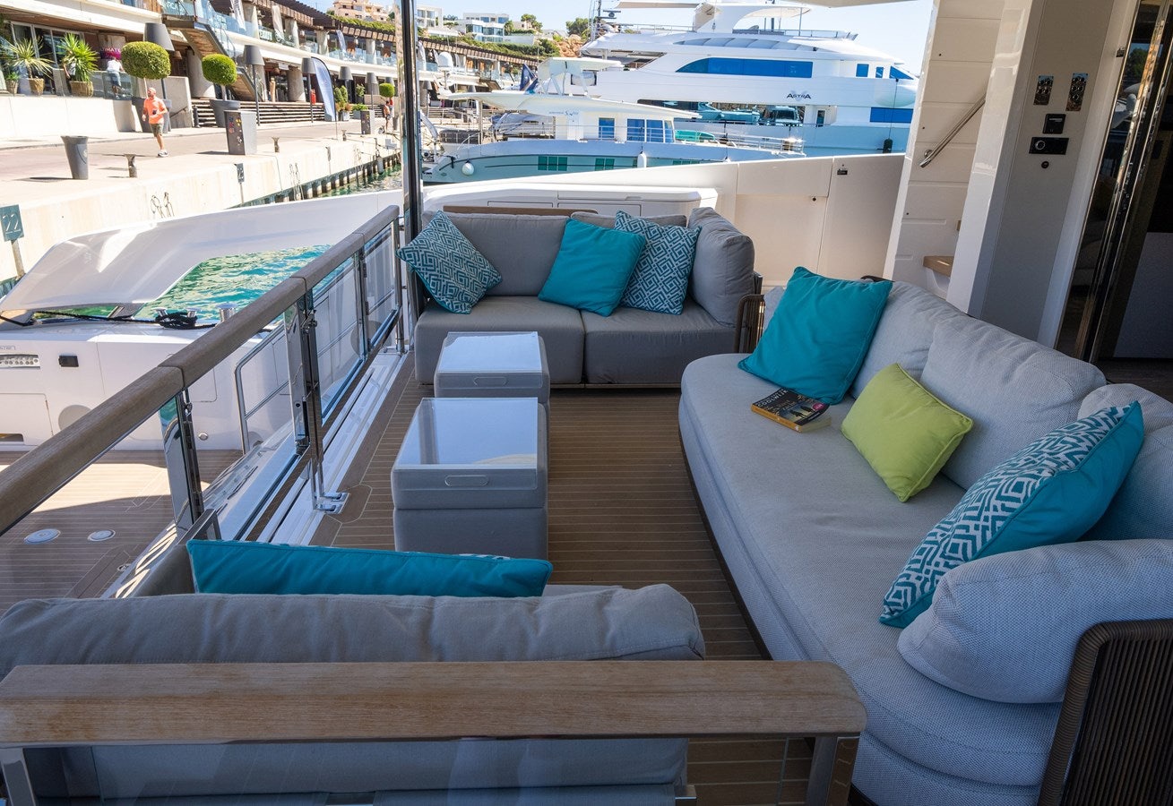 a living room with a couch and a table aboard BANDAZUL Yacht for Sale