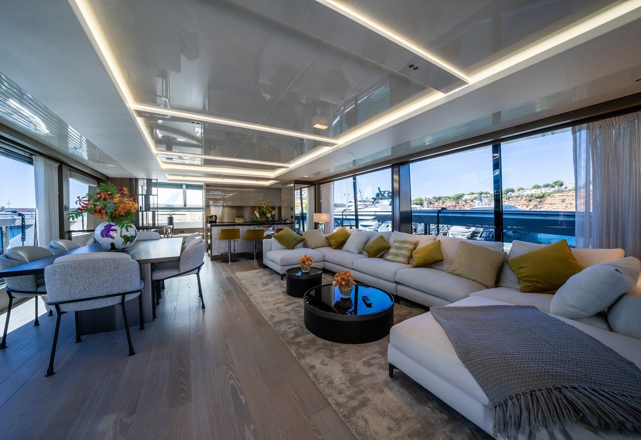 a large living room with a large window aboard BANDAZUL Yacht for Sale
