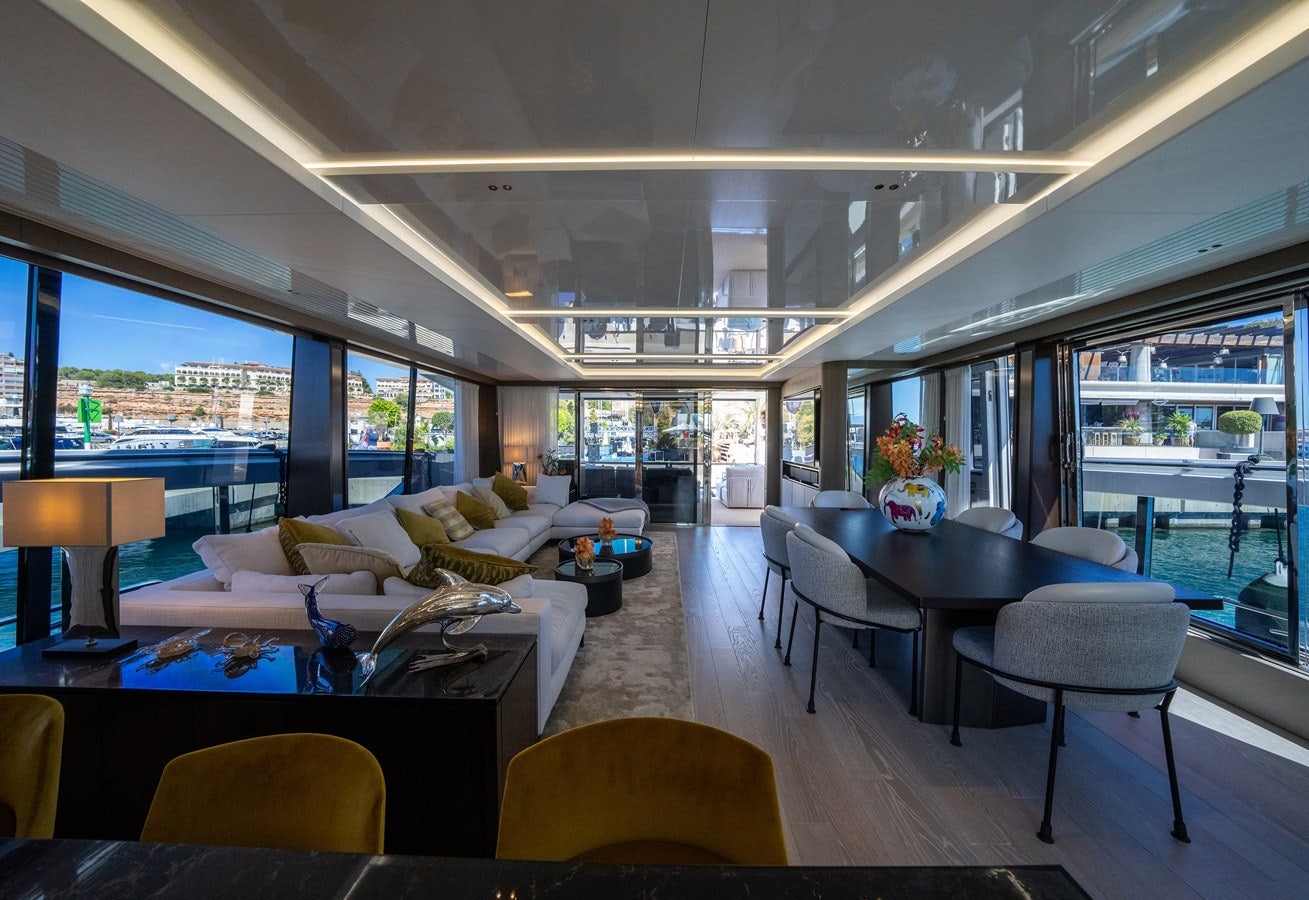 a living room with a large window aboard BANDAZUL Yacht for Sale