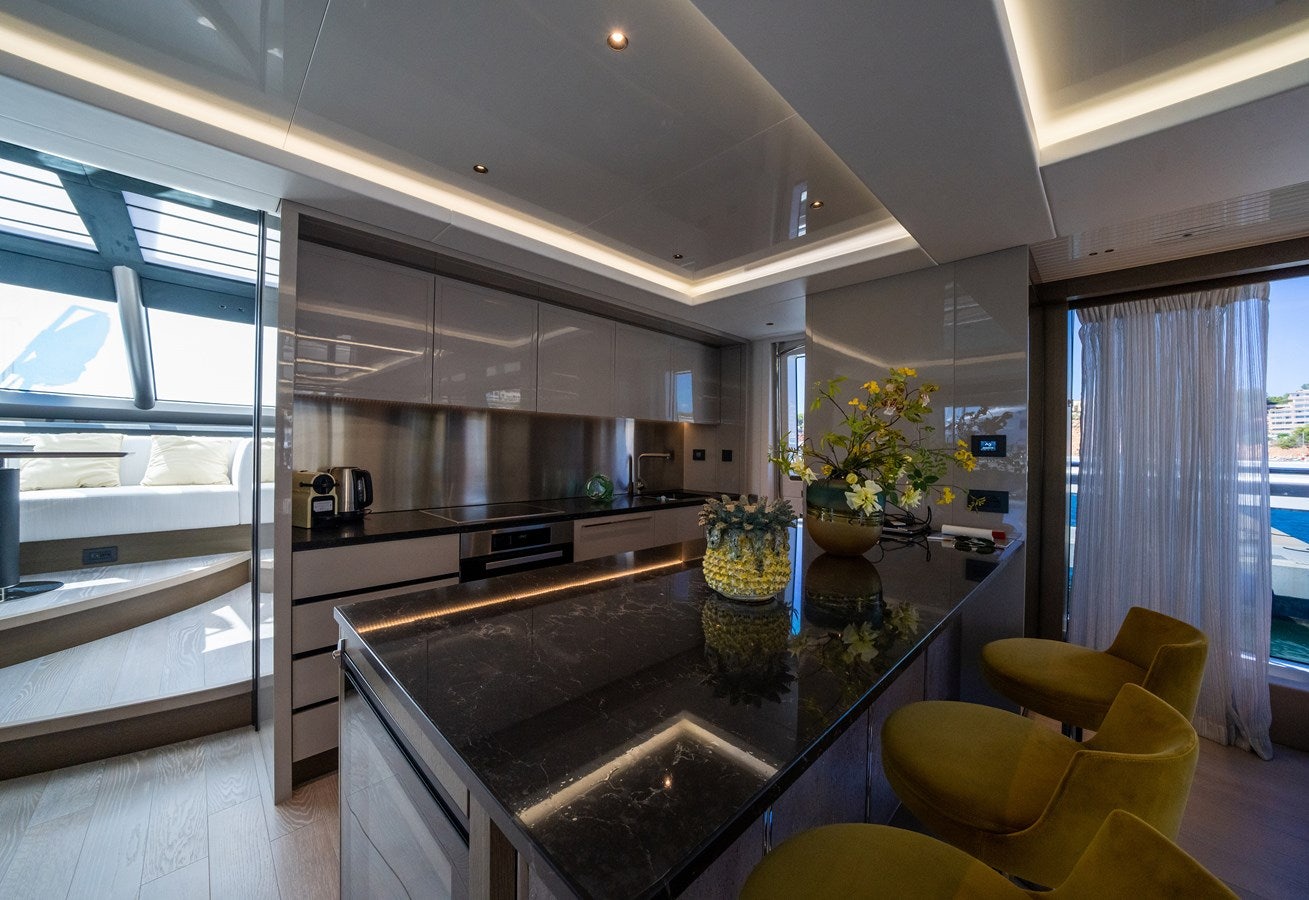 a kitchen with a large island aboard BANDAZUL Yacht for Sale