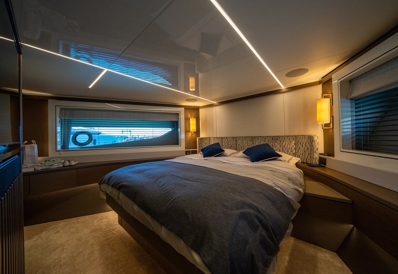 a bedroom with a large tv aboard BANDAZUL Yacht for Sale