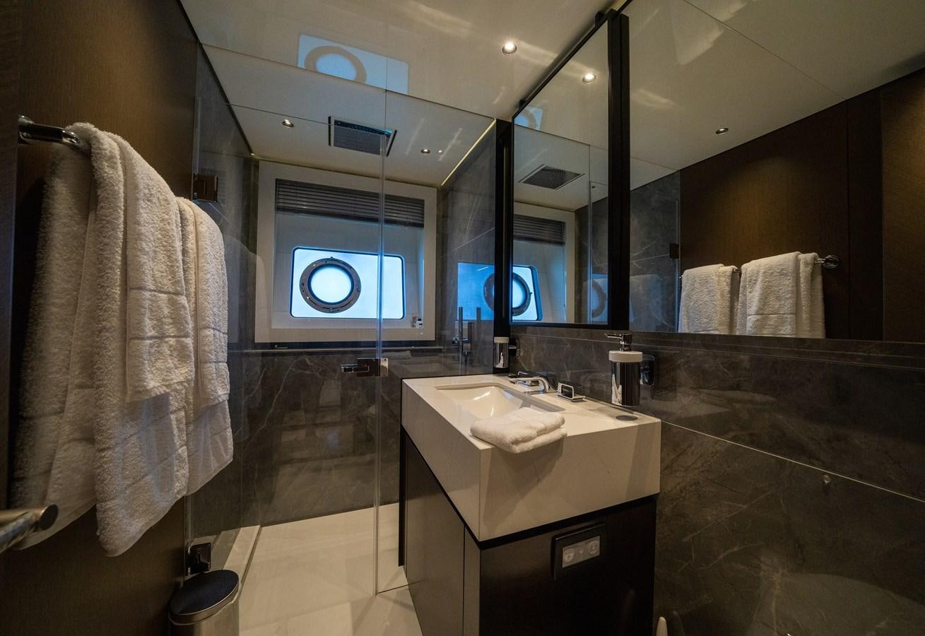 a bathroom with a large mirror aboard BANDAZUL Yacht for Sale