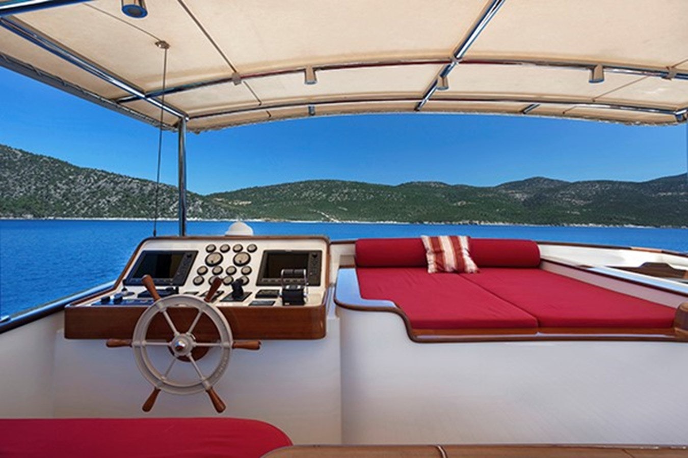 a boat with a logo on the front aboard DARWIN Yacht for Sale