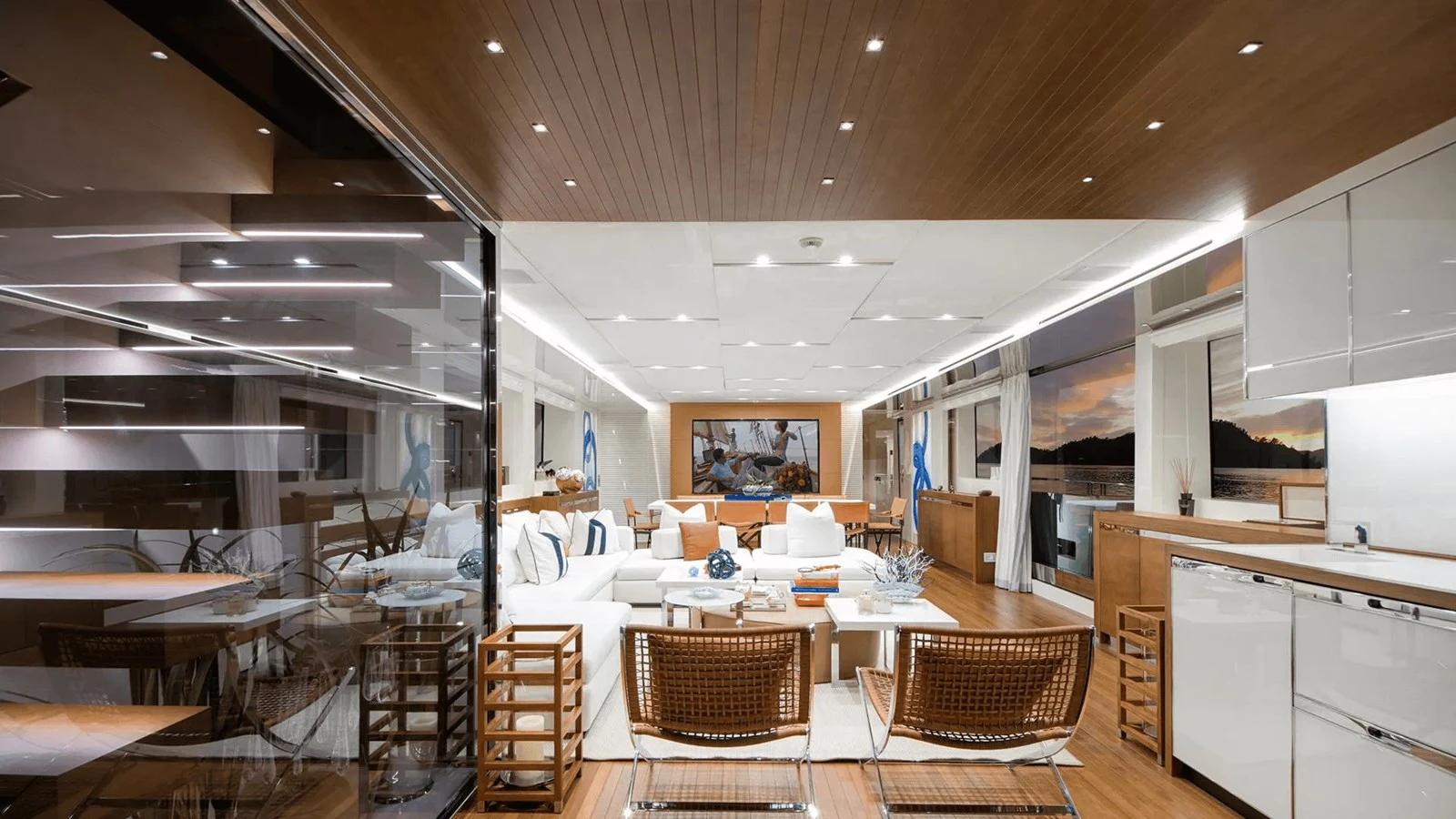 a room with tables chairs and a large window aboard 2018 SANLORENZO SL118 #614 Yacht for Sale