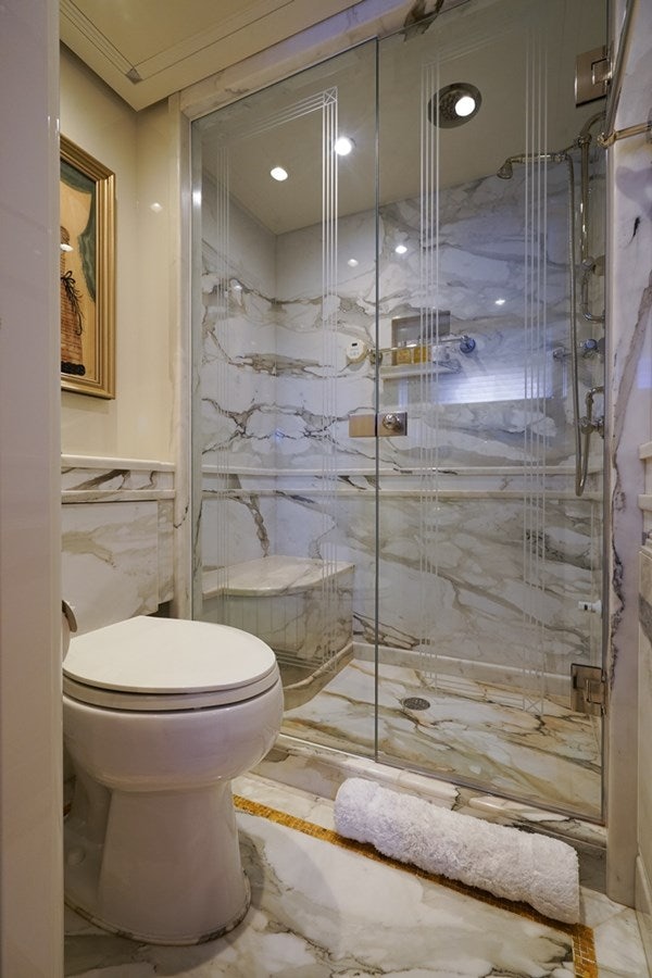 a bathroom with a glass shower aboard SEA CLASS Yacht for Sale