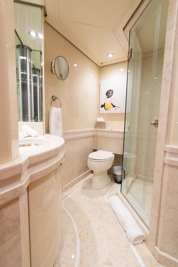 a bathroom with a toilet and a sink aboard SEA CLASS Yacht for Sale