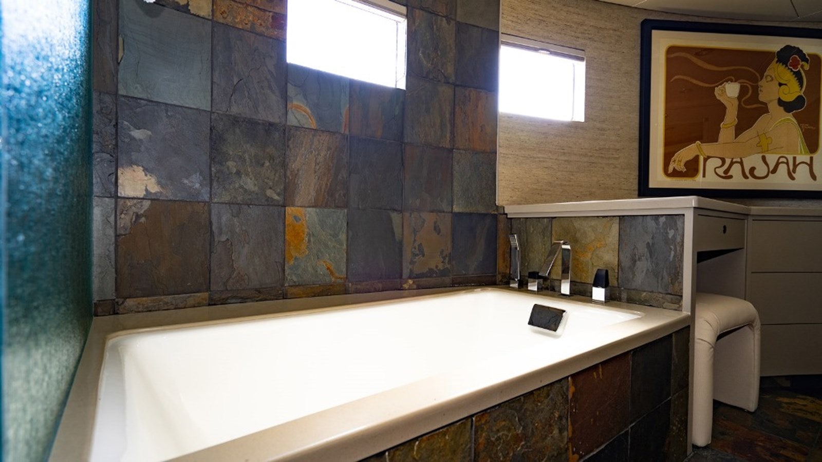 a bathroom with a bathtub and a sink aboard SEA CLASS Yacht for Sale