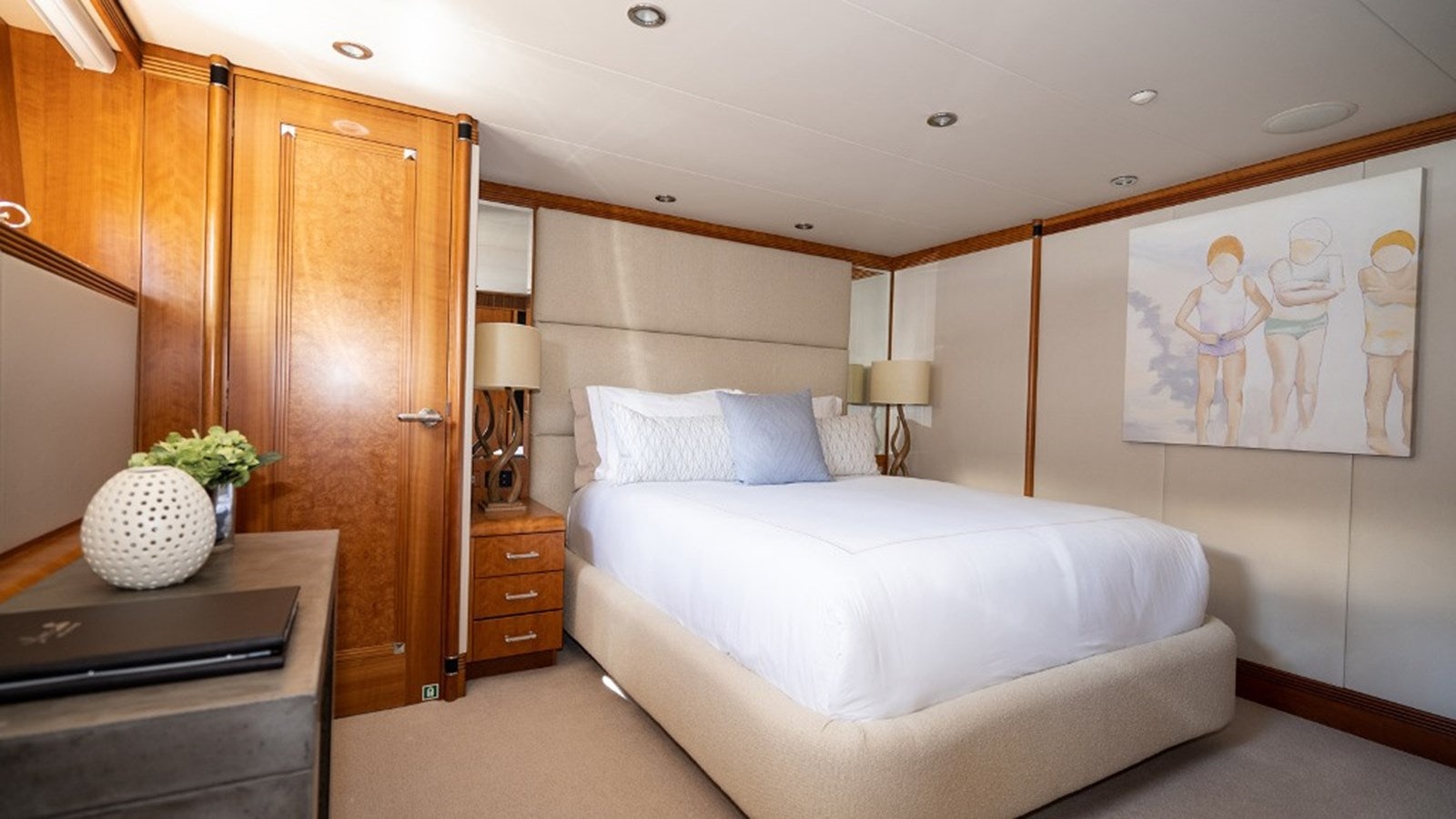 a bedroom with a bed and a cabinet aboard SEA CLASS Yacht for Sale