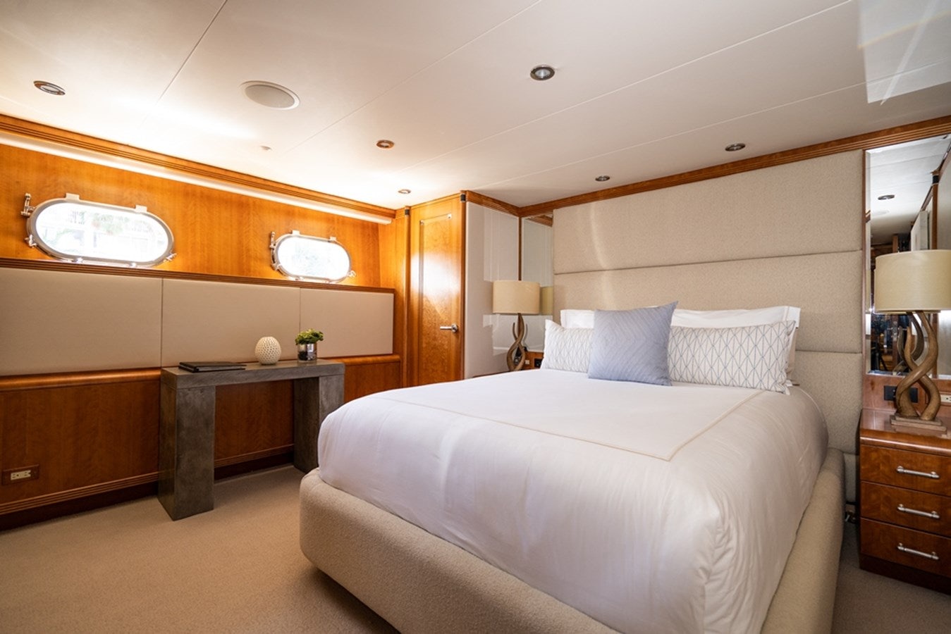a bedroom with a bed and a desk aboard SEA CLASS Yacht for Sale