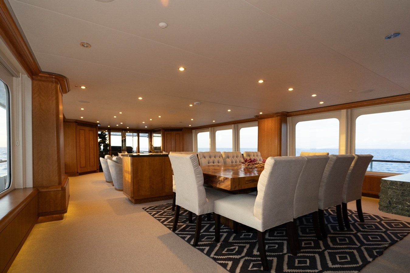 a large living room with a large window aboard SEA CLASS Yacht for Sale
