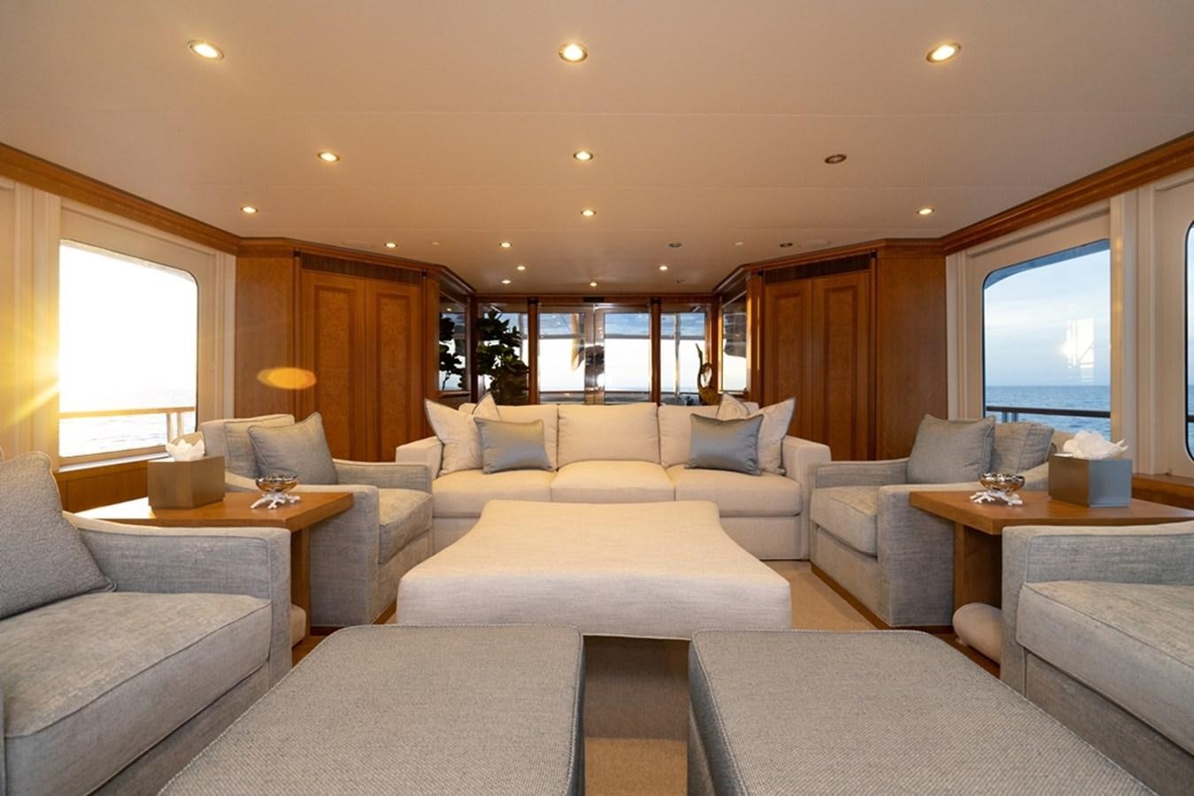 a living room with a large window aboard SEA CLASS Yacht for Sale