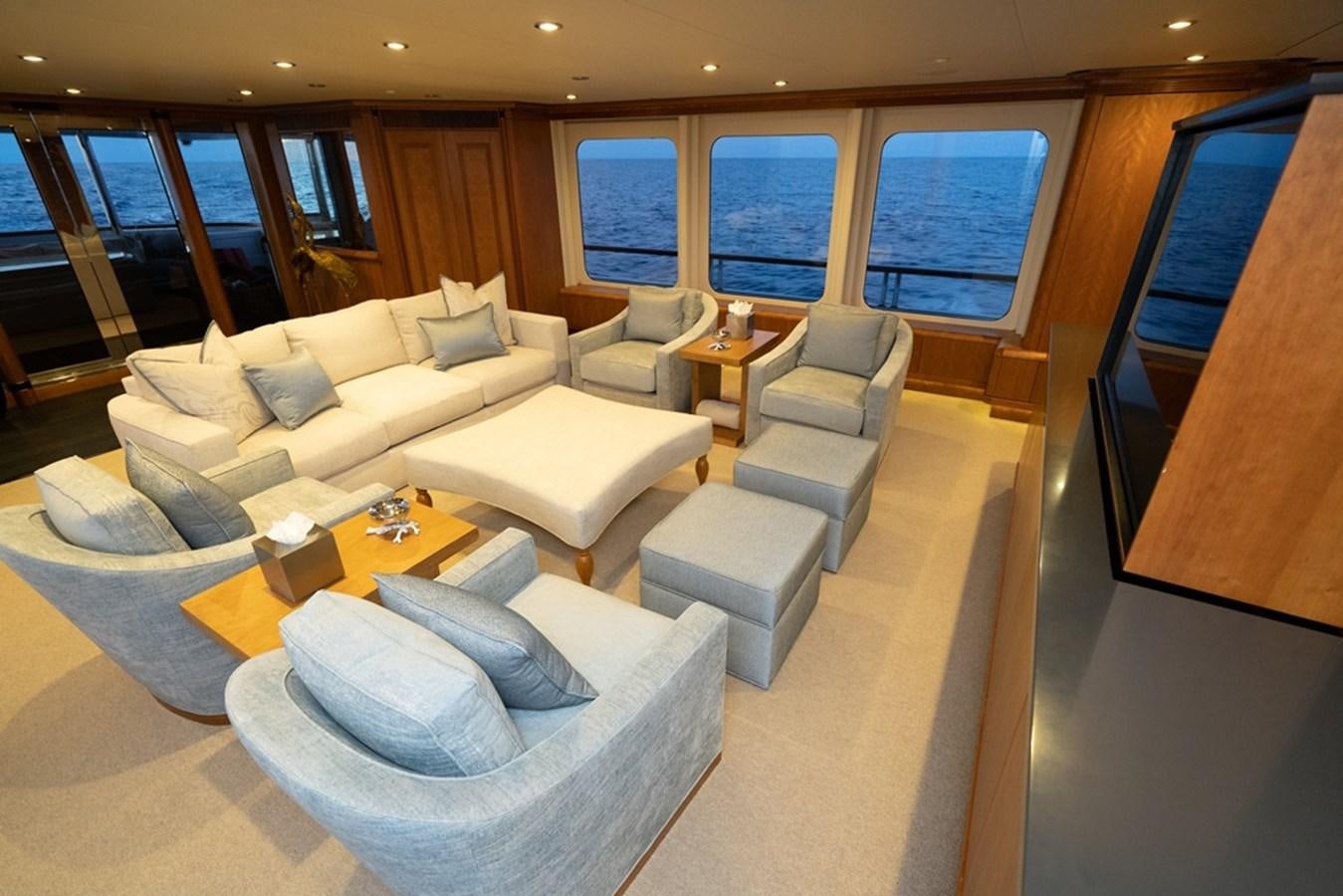 a room with a couch and a table aboard SEA CLASS Yacht for Sale