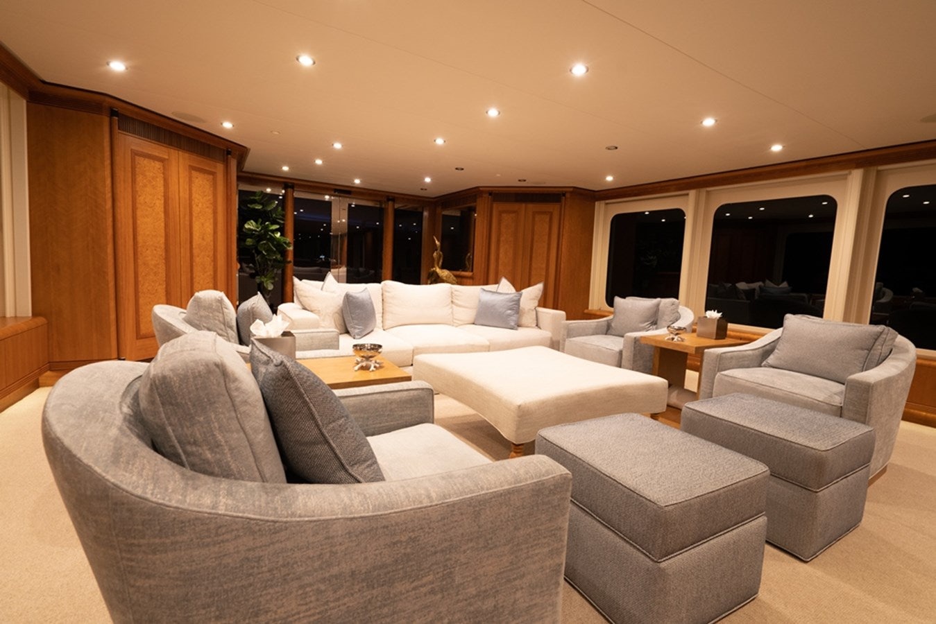 a living room with a couch and a table aboard SEA CLASS Yacht for Sale