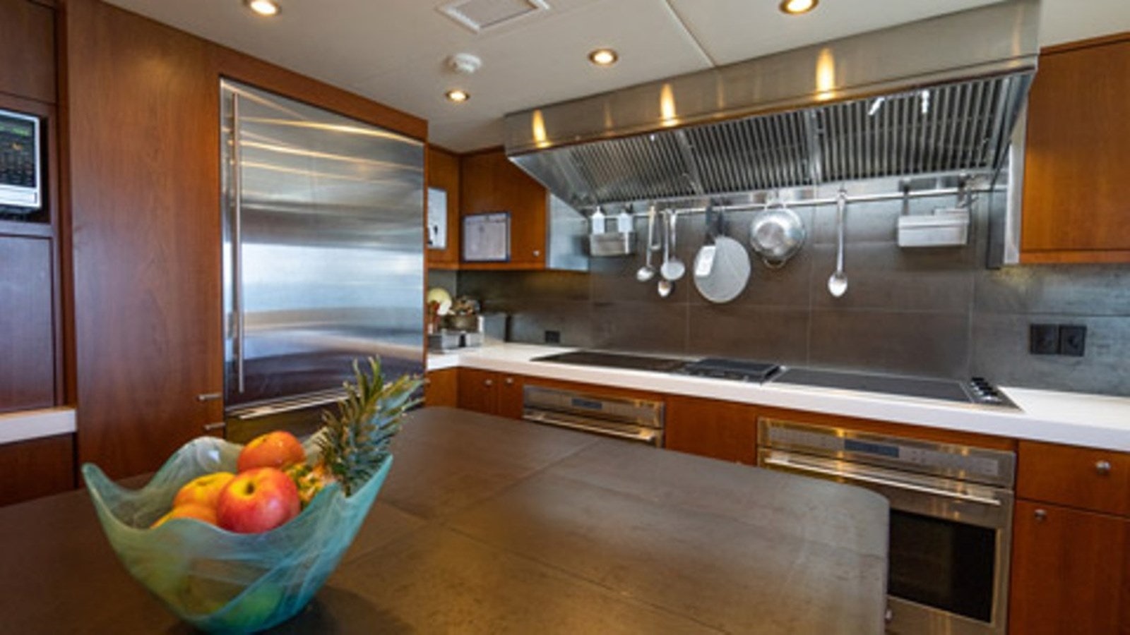 a kitchen with a large island aboard SEA CLASS Yacht for Sale