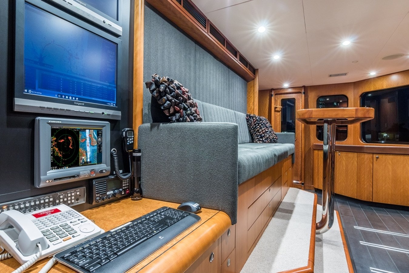 a living room with a computer and a television aboard SEA CLASS Yacht for Sale