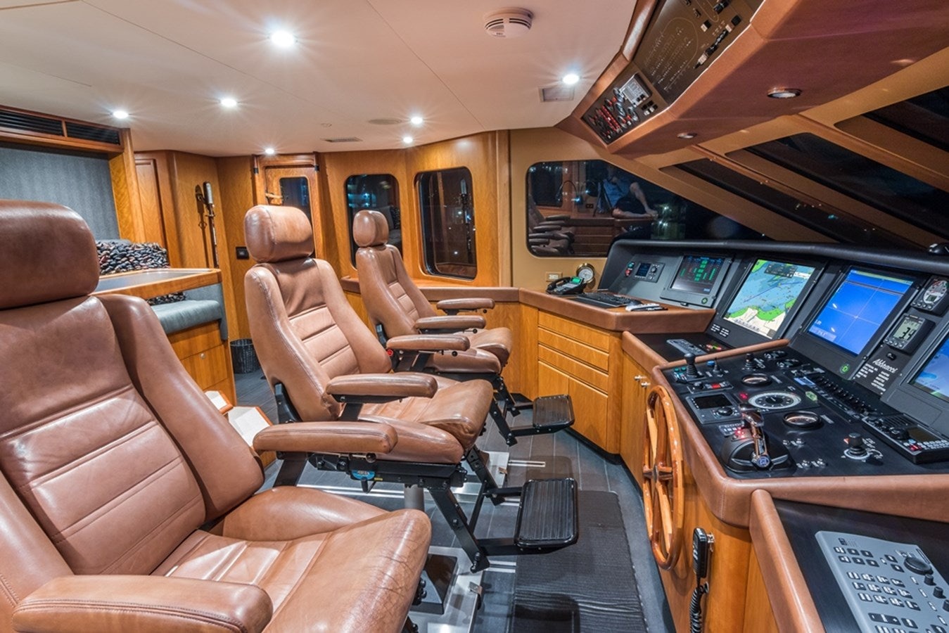 a room with a desk and chairs aboard SEA CLASS Yacht for Sale
