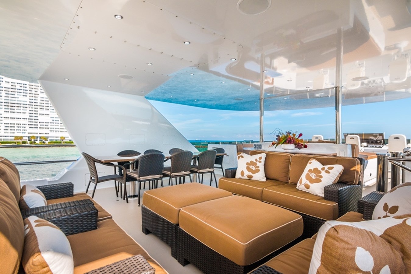 a living room with a large blue and white umbrella aboard SEA CLASS Yacht for Sale