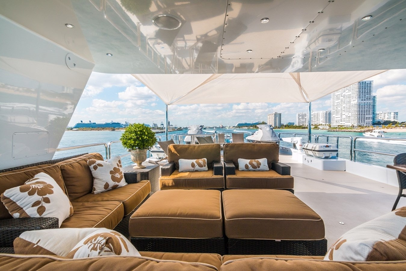 a room with a couch and a table and a large window aboard SEA CLASS Yacht for Sale