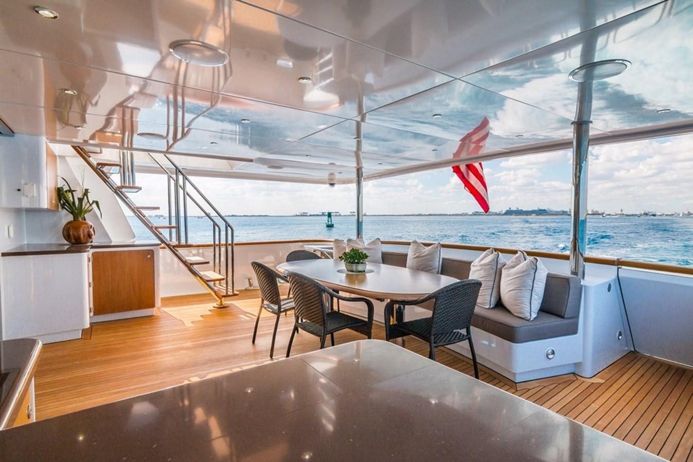 a room with a table and chairs aboard SEA CLASS Yacht for Sale