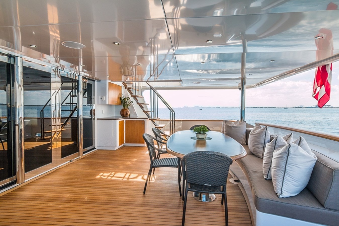 a room with a table and chairs aboard SEA CLASS Yacht for Sale