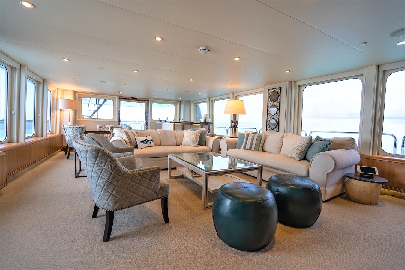 a living room with a large window aboard SEA CLASS Yacht for Sale