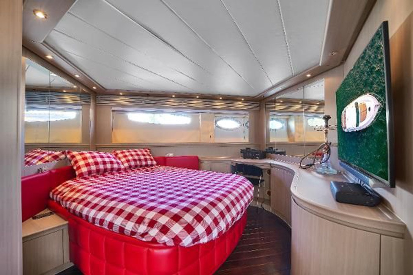 a room with a bed and a green screen aboard GHOST Yacht for Sale