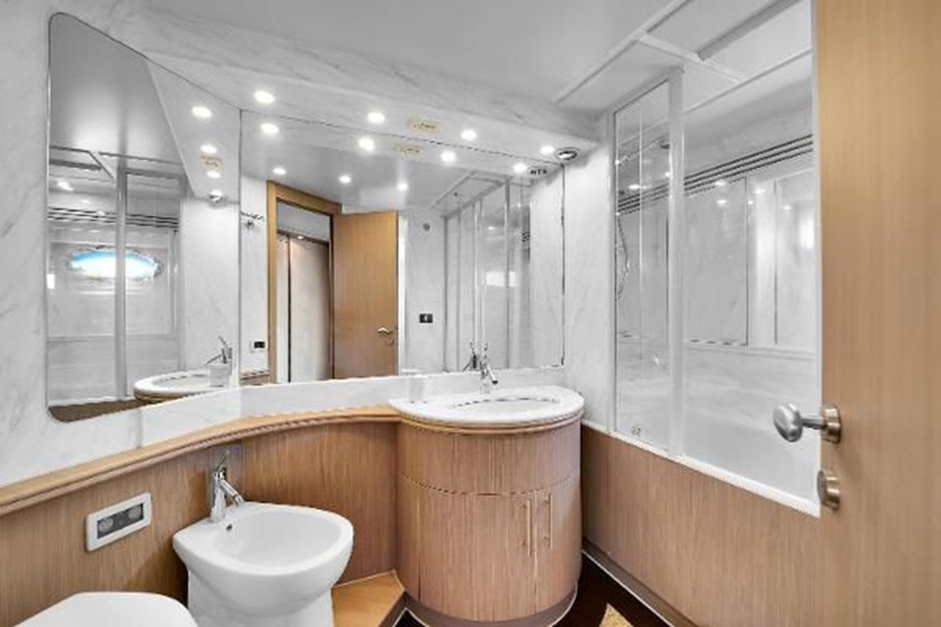 a bathroom with a large mirror aboard GHOST Yacht for Sale