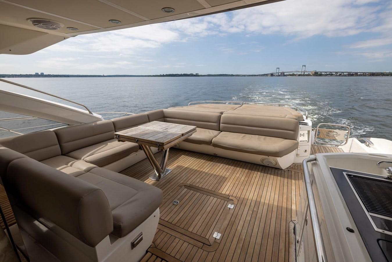 a boat on a deck aboard YOLO Yacht for Sale