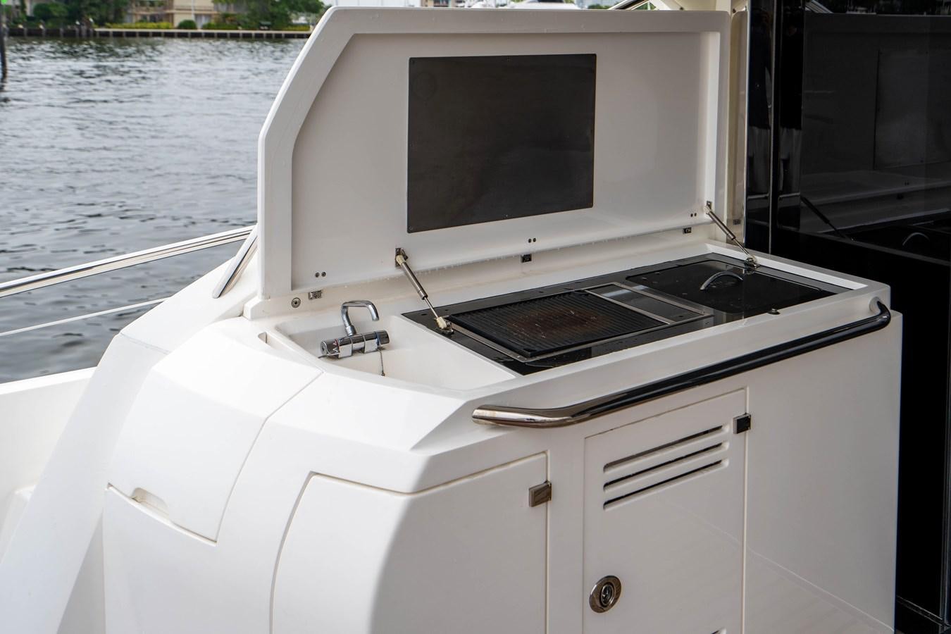 a white microwave on a boat aboard YOLO Yacht for Sale