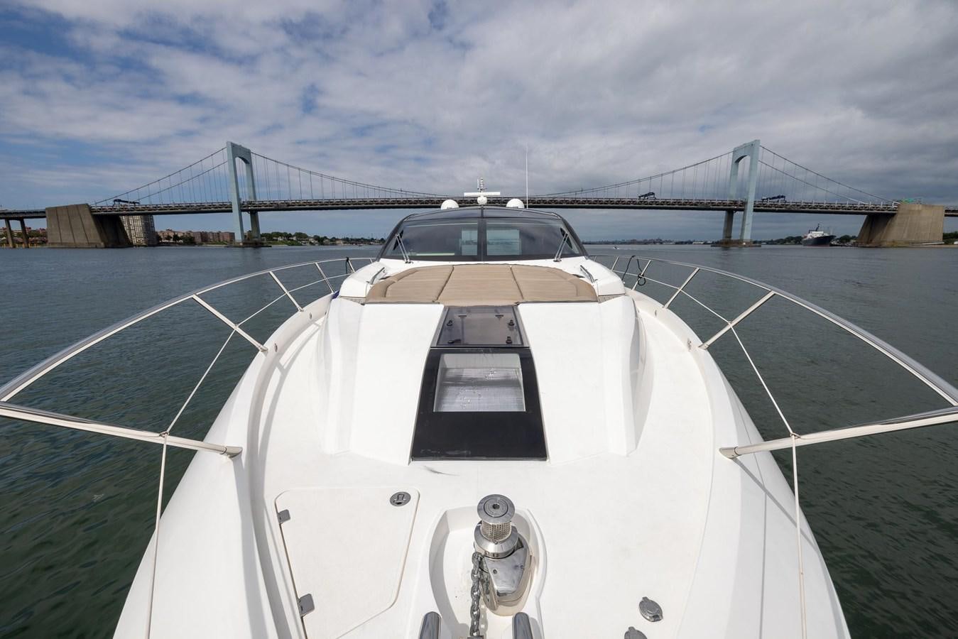 a white car on a road aboard YOLO Yacht for Sale