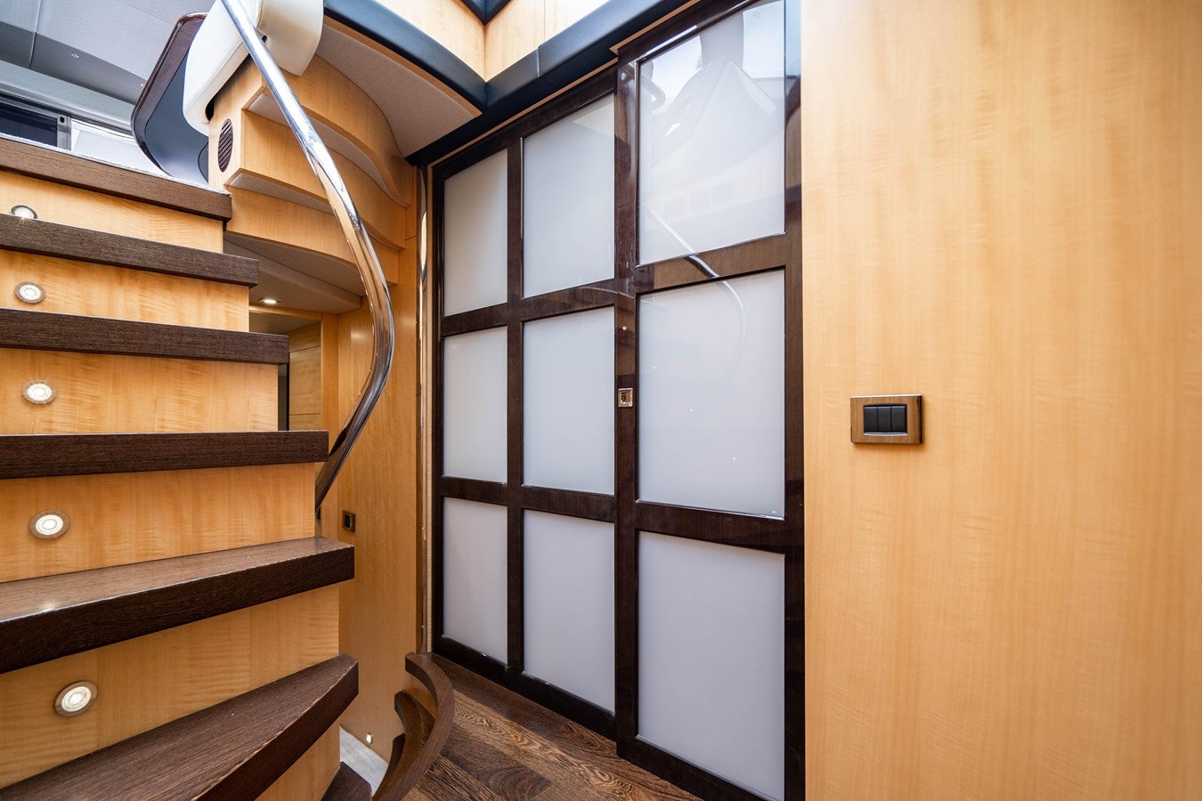 a room with wooden cabinets aboard YOLO Yacht for Sale