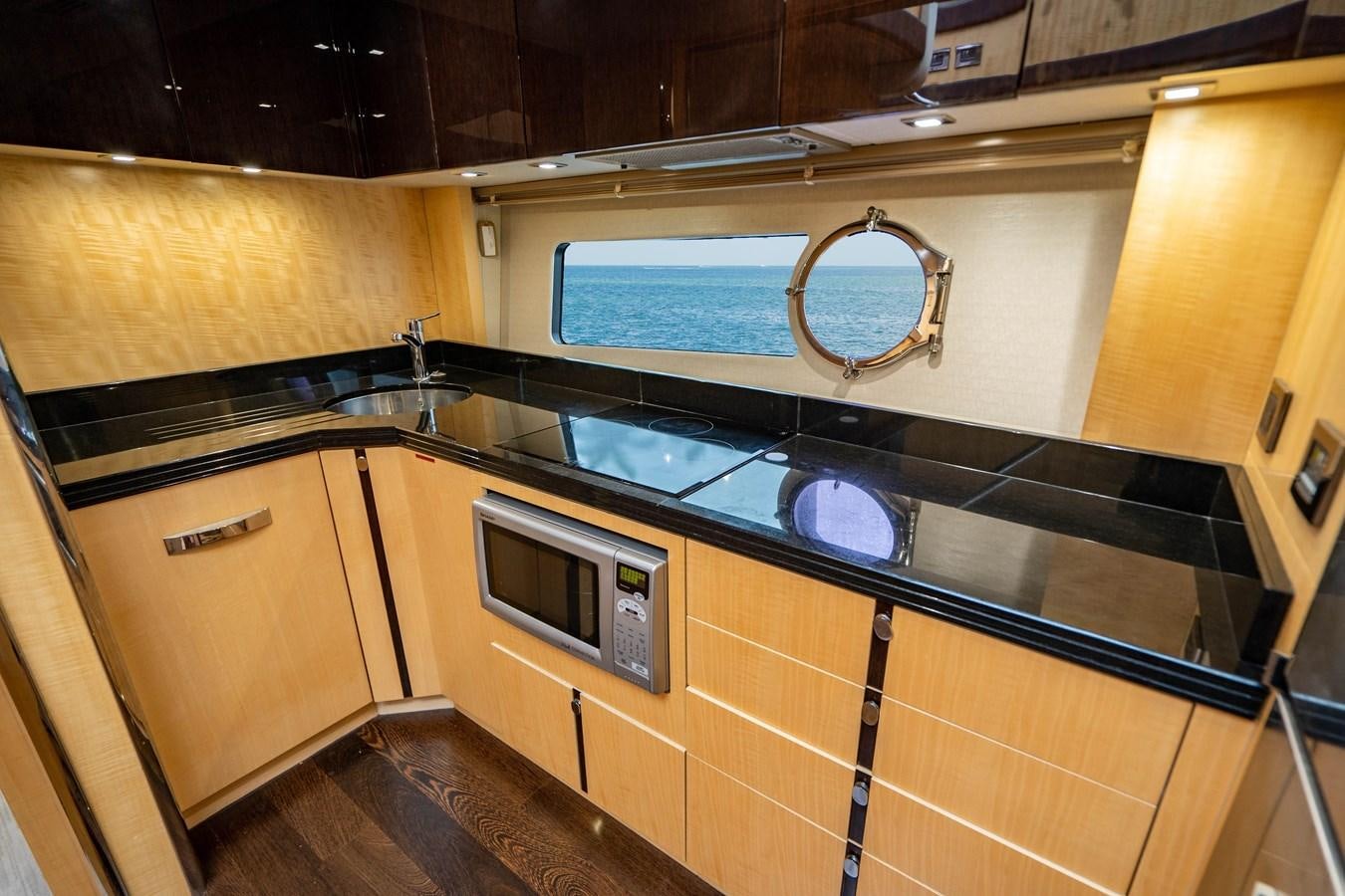 a kitchen with a microwave oven aboard YOLO Yacht for Sale